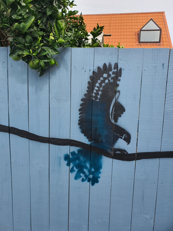 New Zealand Falcon, depicted on fence in silhouette, Fence mural